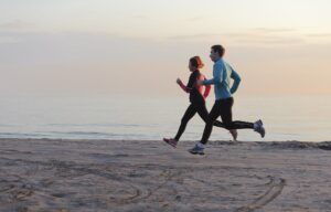 A Healthy Couple Jogging on the Beaches of Santa Barbara