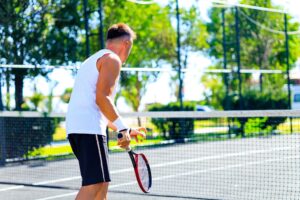 Man playing tennis after recovering from shoulder replacement